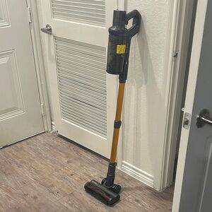 Cordless Stick Vacuum Cleaner with Gold and Black Design